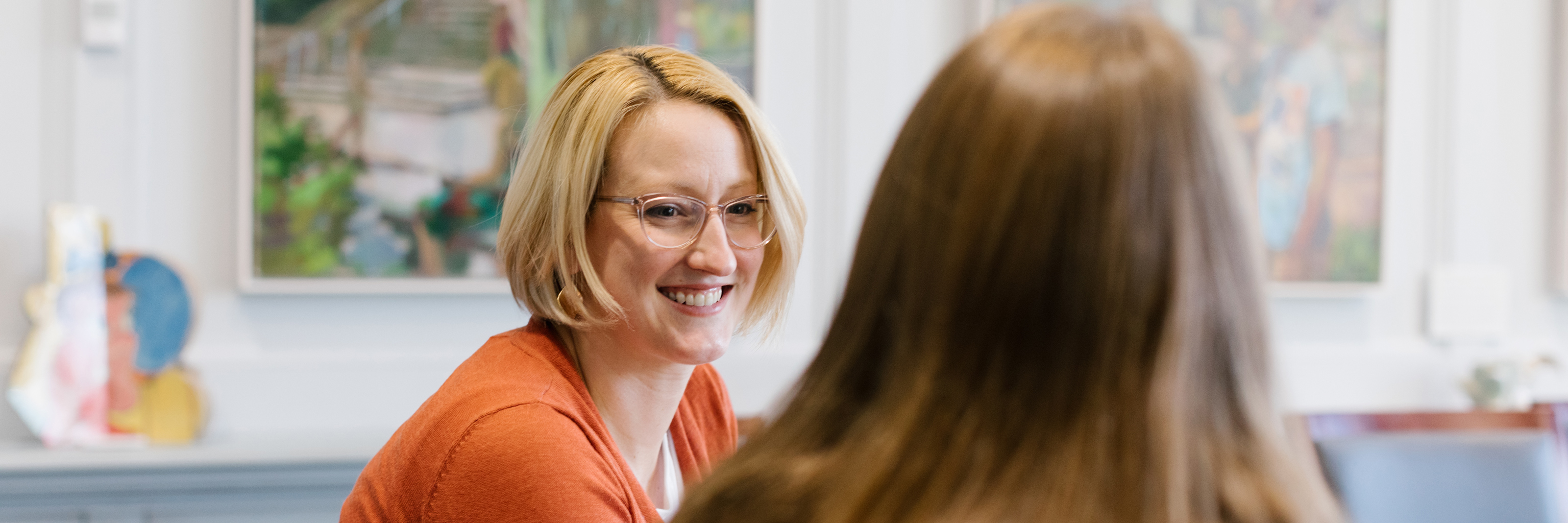 A female advisor talking to a female student.